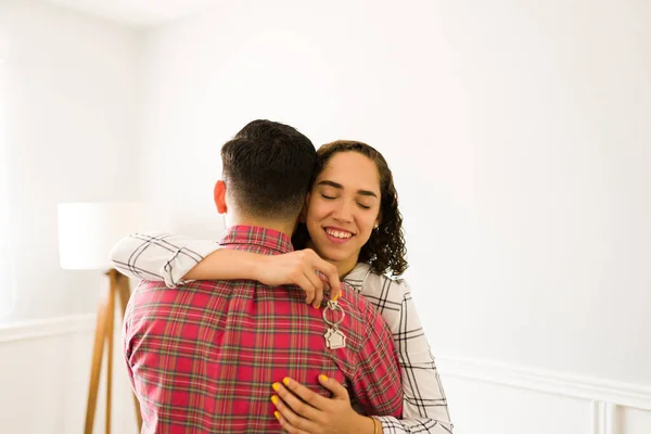 Grateful Young Woman Hugging Her Partner Receiving New House Keys — 图库照片