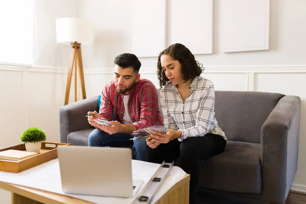 Smart Young Couple Using Calculator While Making Budget Home Improvements — Foto de Stock