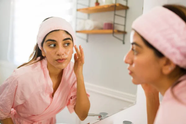 Hispanic Woman Bathrobe Doing Using Skin Care Products Putting Moisturizer — Φωτογραφία Αρχείου