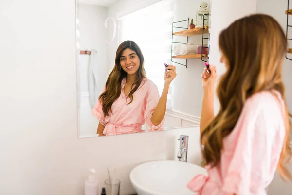 Gorgeous Hispanic Woman Using Lipstick Draw Heart Bathroom Mirror While — Stockfoto