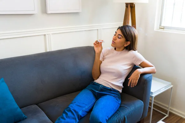 Latin Young Woman Lying Sofa Home While Smoking Cannabis Help —  Fotos de Stock