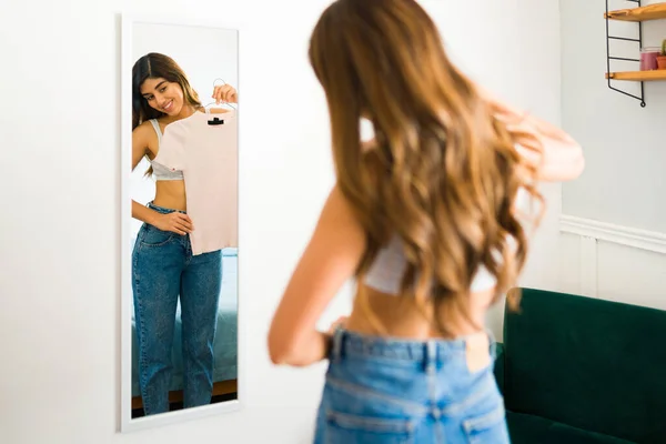 Gorgeous Latin Woman Putting Together Outfit Looking Mirror While Changing — Stockfoto