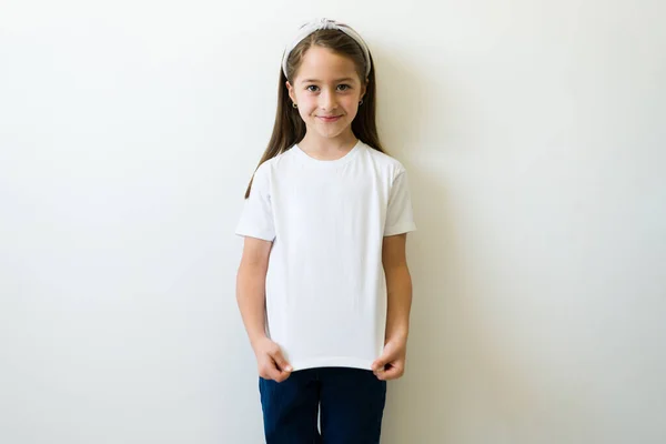 Beautiful Little Girl Showing Design Print Logo Her Mockup White — стоковое фото