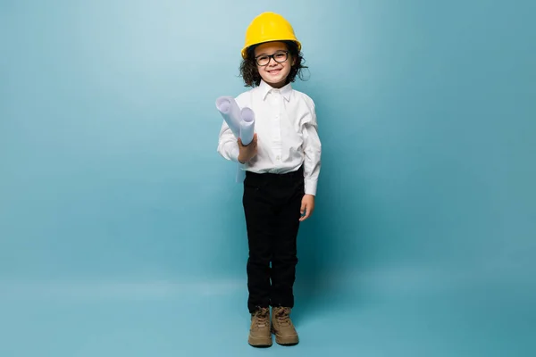Full Length Beautiful Kid Holding Construction Plans While Having Aspiring — Stockfoto