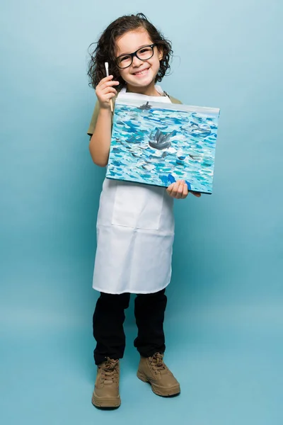 Excited Caucasian Child Showing His Beautiful Painting Smiling While Dreaming — Stockfoto