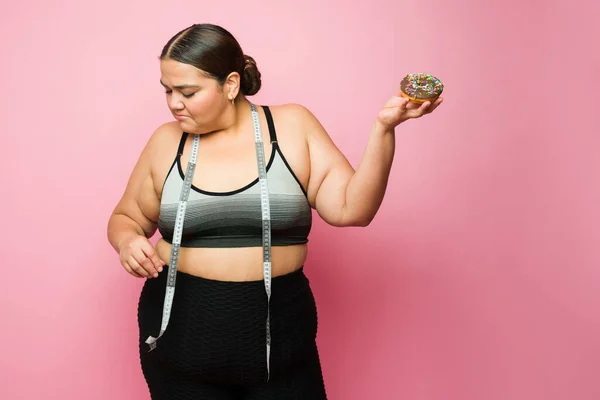 Satisfied Fat Woman Diet Eating Donut Doing Her Fitness Exercises — Zdjęcie stockowe