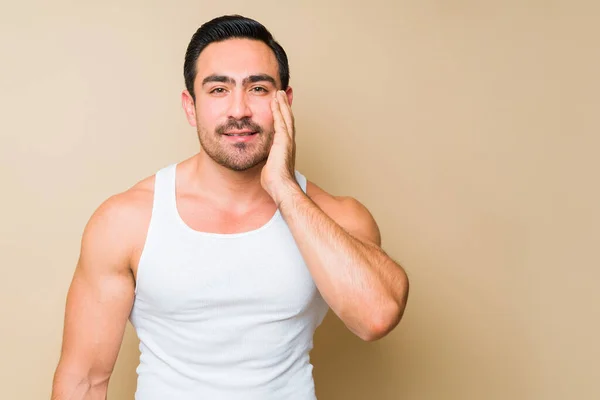 Studio Shot Happy Caucasian Man Wearing Undershirt Touching His Face — Stockfoto
