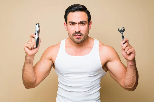 Worried Young Man His 20S Grooming Holding Disposable Razor Electric — Stok fotoğraf