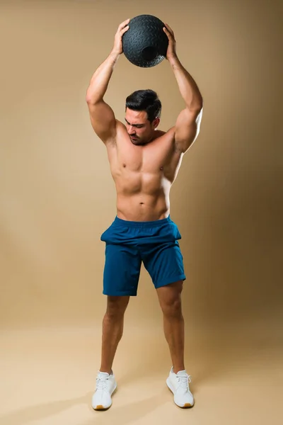 Active Muscular Shirtless Man Doing Cross Training Using Slam Ball — Stok fotoğraf