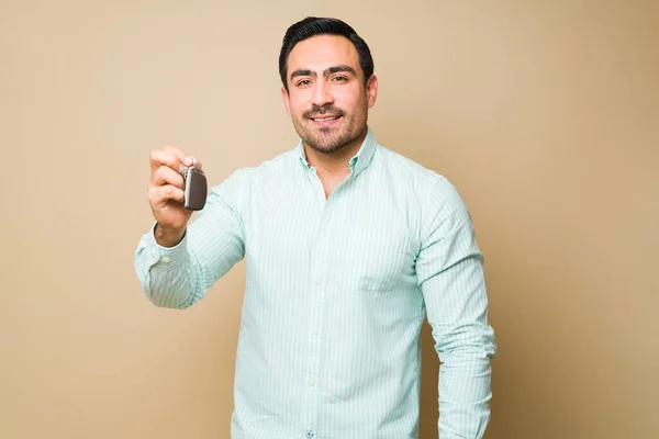 Happy Hispanic Young Man Looking Camera Smiling While Showing His — Stockfoto