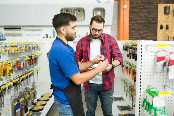 Happy Young Man Working Hardware Store Helping Male Customer Looking — Photo