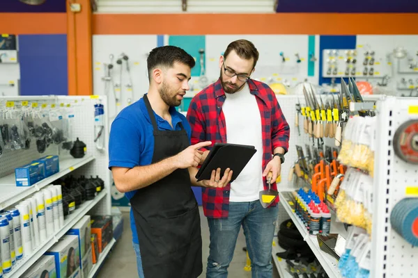 Young Man Working Customer Assistance Hardware Store Talking Client Shopping — Stockfoto