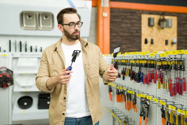 Attractive Young Man Shopping Hardware Store Making Decision Choosing Buy — Fotografia de Stock