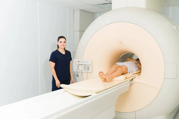 Beautiful Radiologist Technician Smiling Looking Happy While Doing Magnetic Resonance — Fotografia de Stock