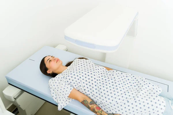 High Angle Beautiful Young Woman Lying Screening Machine Getting Densitometry — Fotografia de Stock