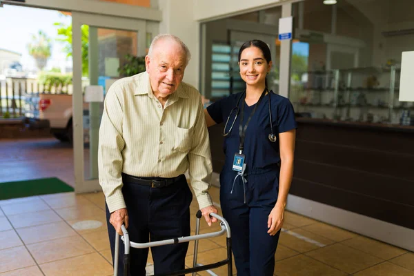 Portrait Female Smiling Nurse Helping Happy Older Mature Man Walker — Stock Photo, Image