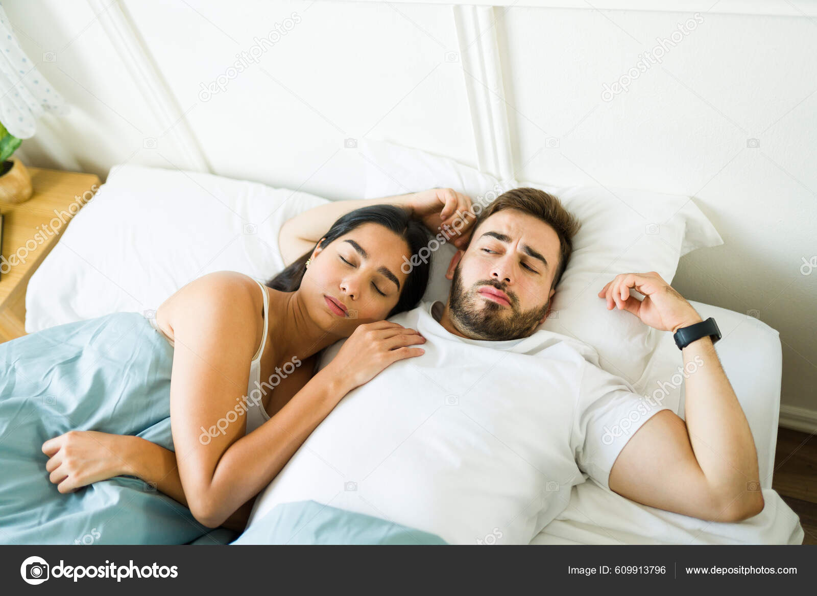 Upset Annoyed Caucasian Man Feeling Waking Bed Woman Cuddling Feeling Stock Photo by ©tonodiaz 609913796