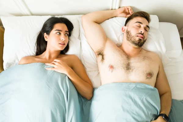 Stressed Young Woman Looking Sleeping Caucasian Man While Waking Together — Stock Photo, Image