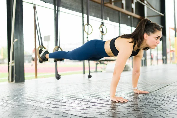 Strong Young Woman Using Trx Training Rings While Doing Push — Stock Photo, Image