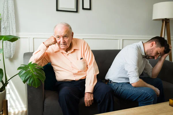 Old Man Feeling Unwell Stomach Ache While Sitting Sofa Home Stock Photo by  ©tonodiaz 185958792