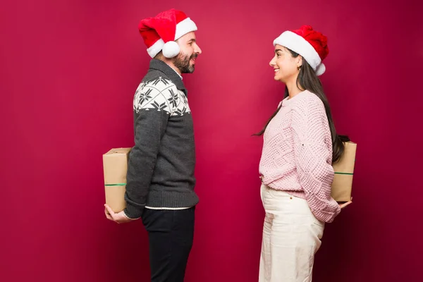 Profile Cheerful Loving Couple Hiding Christmas Presents Surprising Each Other — Stock Photo, Image