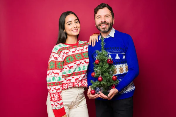 Portrait Smiling Young Couple Excited Holidays While Putting Christmas Decorations — Stock Photo, Image