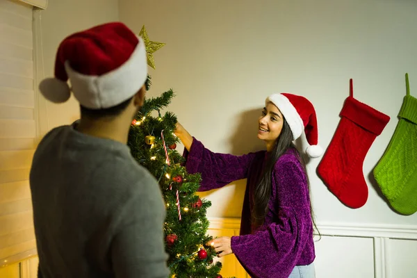 Cheerful Latin Woman Laughing Her Partner While Putting Decorations Together — Stock Photo, Image