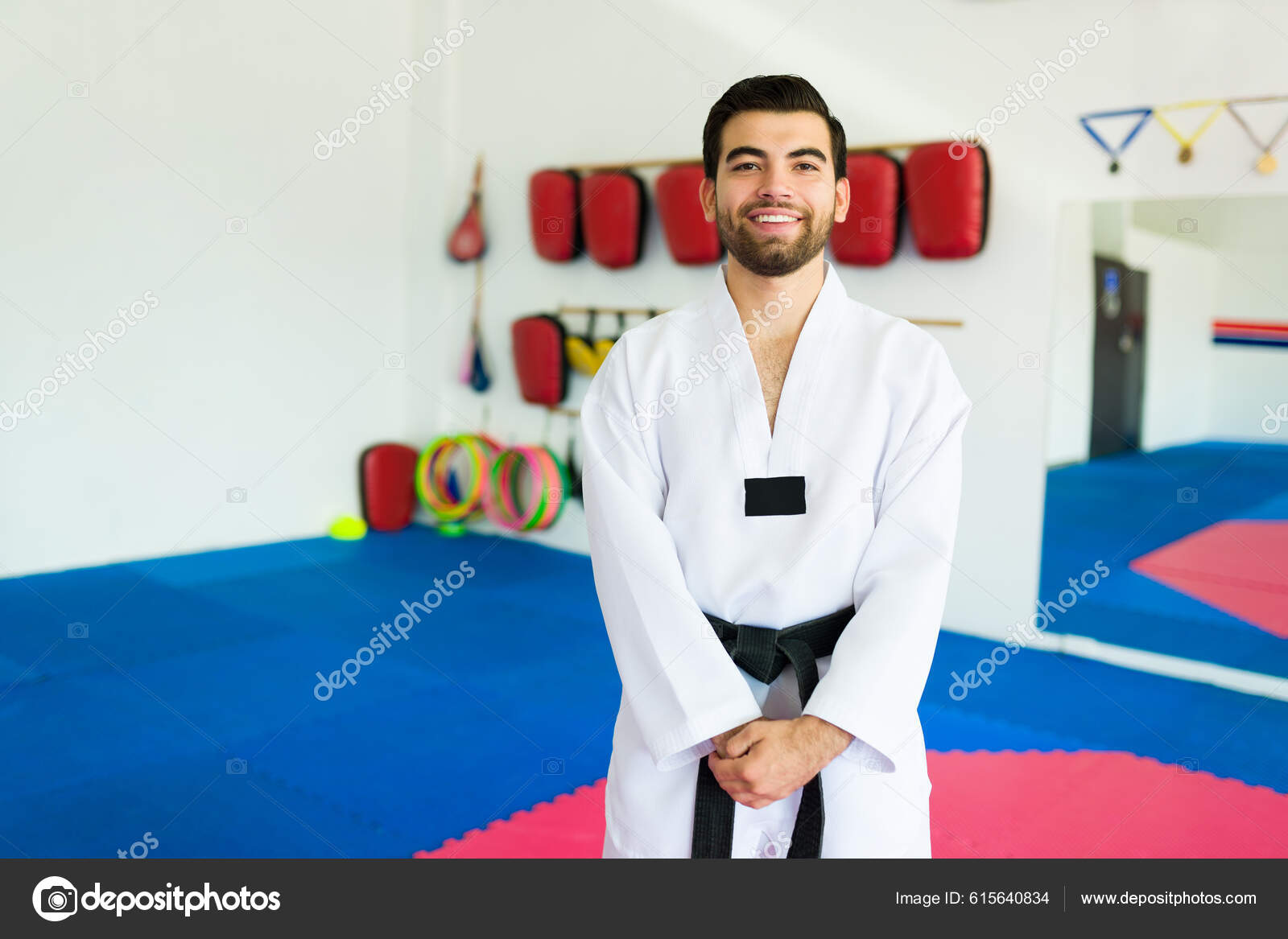 Attractive Happy Martial Arts Trainer Smiling While Ready Black Belt
