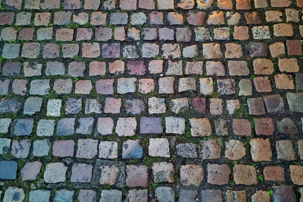 街の古い部分の古い舗装石 石の質感で作られています — ストック写真
