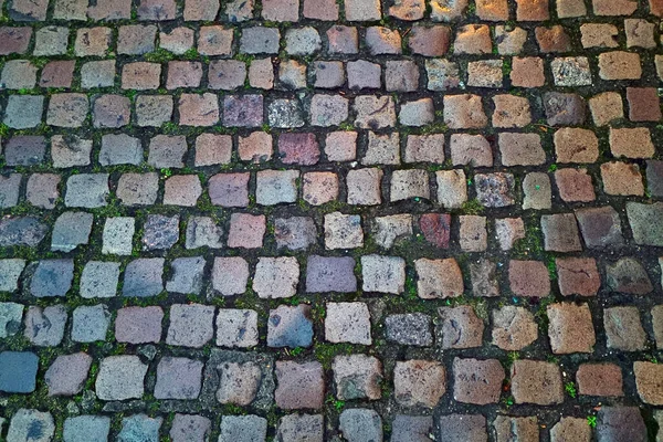 背景是由旧城区的旧铺路石制成的 石头的质地 — 图库照片