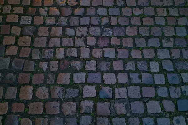 石の質感の暗い背景 街のスラブ舗装 — ストック写真