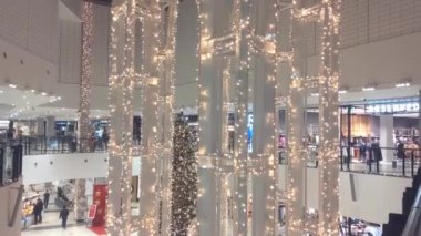 Wroclaw, Poland, December 14, 2021: Decorated bright mall with different shops. Preparing for Christmas and New Years