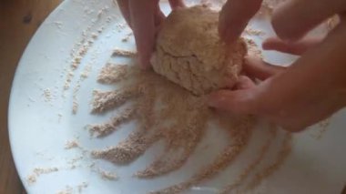 Girl's hands prepare homemade food. Cooking cheesecakes