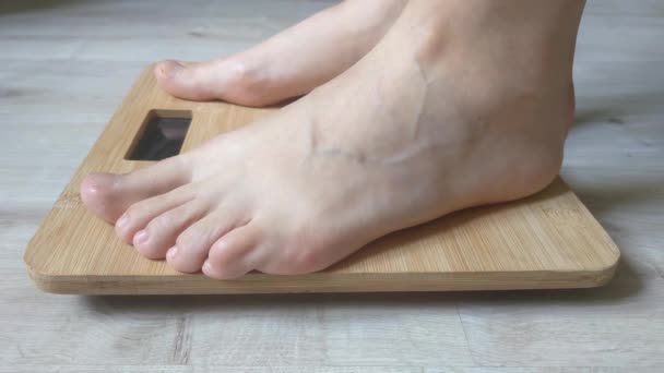 Woman Checks Her Weight Scales Girl Legs Come Scales Weight — Stockvideo