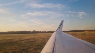 London, United Kingdom, June 27, 2022: Ryanair plane takes off during sunset. Beautiful and bright takeoff. Flight on a modern aircraft. Ryanair is an Irish airline and the largest low cost airline in Europe
