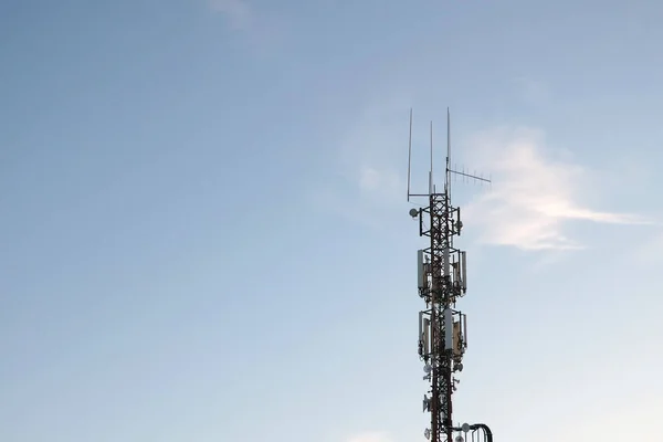 Cellular tower against the blue sky. Modern technologies