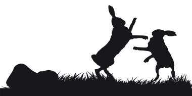 Hares hopping on grass - black and white silhouette vector
