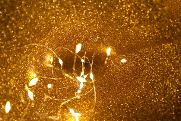 Glitter background, glowing lights garland — Stock Photo, Image