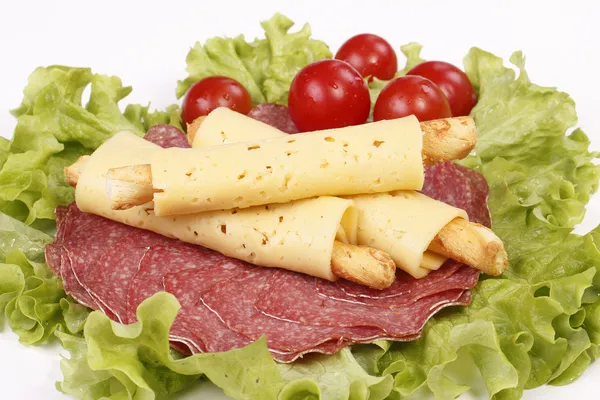 Salty cheese crackers with salami and tomatoes — Stock Photo, Image