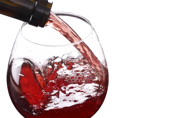 Red wine pouring down from a wine bottle — Stock Photo, Image