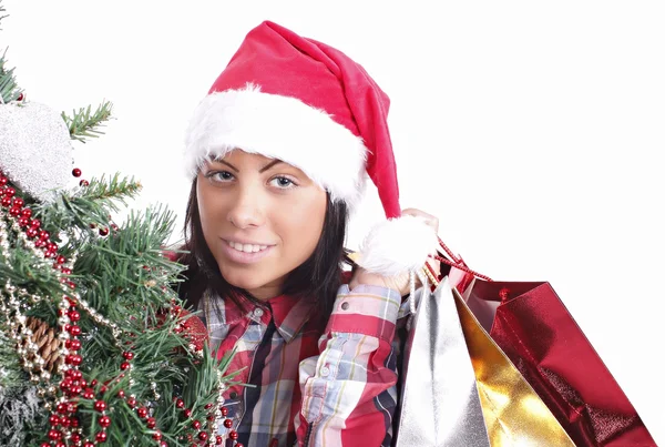 Young girl in Santa hat with gifts — Stock Photo, Image