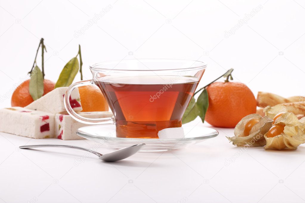 Breakfast with tea, mandarin orange and physalis
