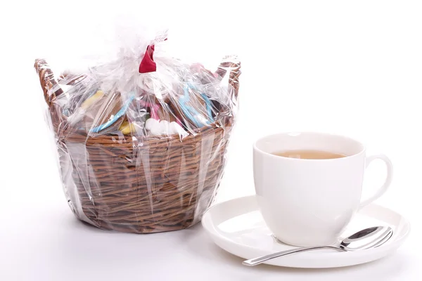 Cup of tea and a basket of cookies — Stock Photo, Image