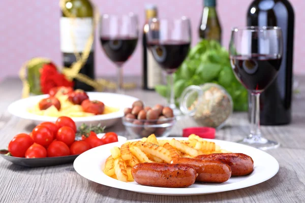 Plate with sausage and potato — Stock Photo, Image