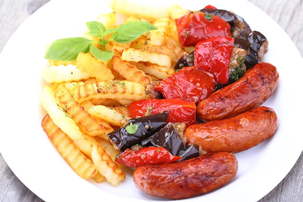 Grilled sausages and fried potatoes — Stock Photo, Image