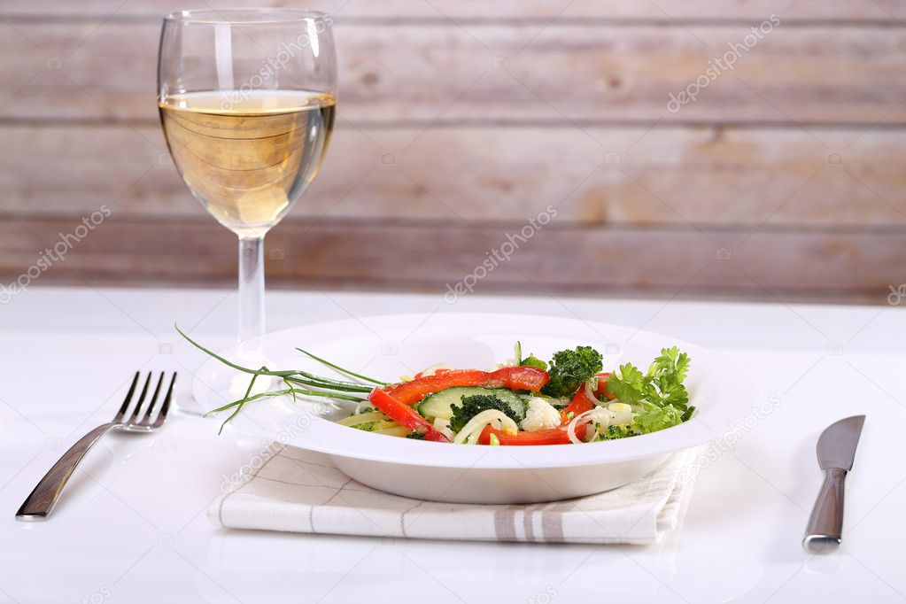 Vegetable salad and white wine