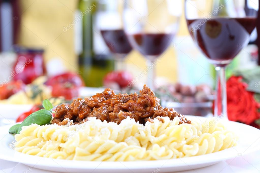 pasta bolognese with basil and wine