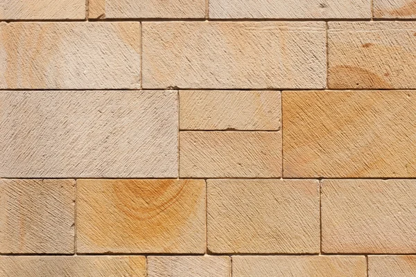 Parete di blocchi di pietra marrone — Foto Stock