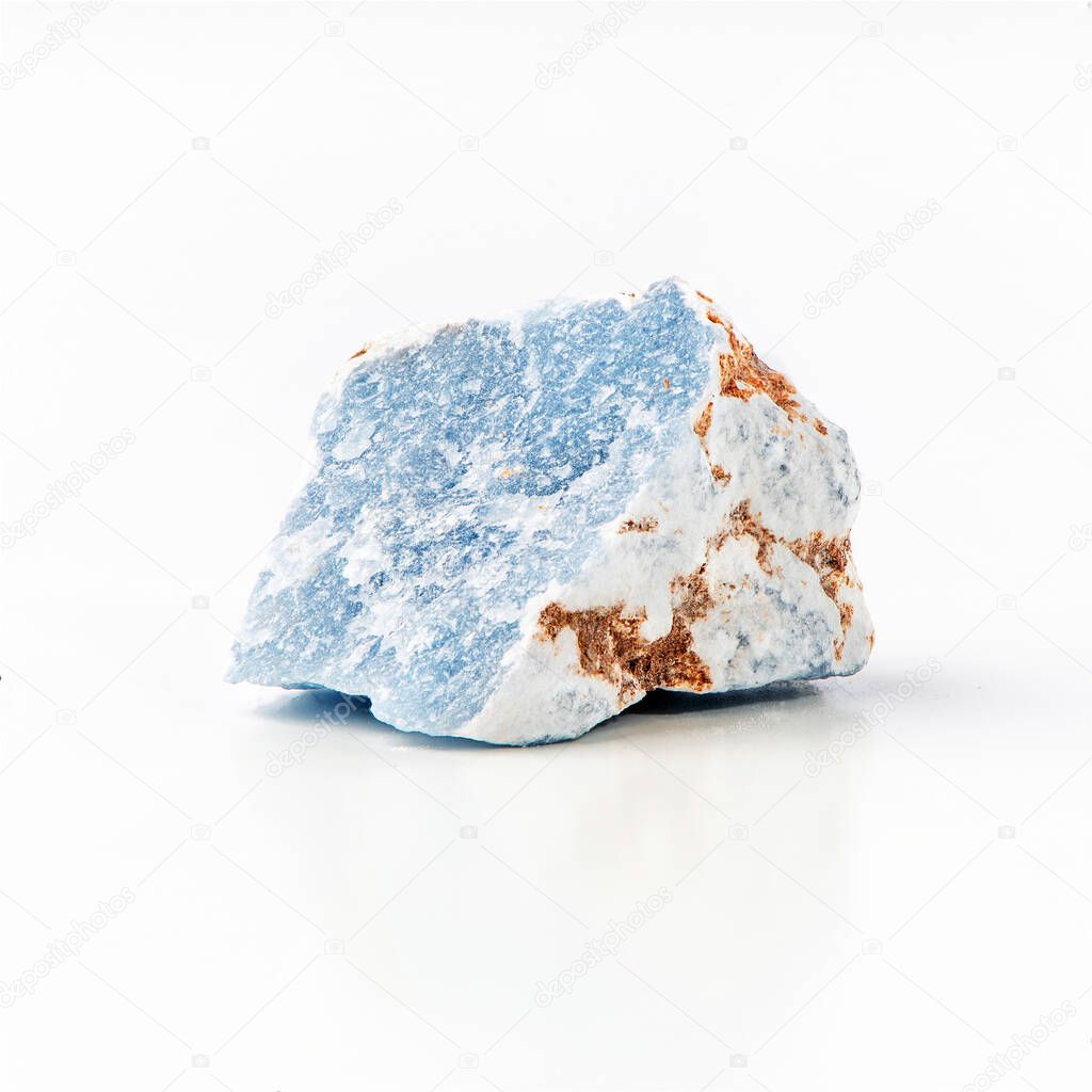 Blue anhydrite mineral isolated on white background. Angelite rough mineral stone of light blue color. Calcium sulfate