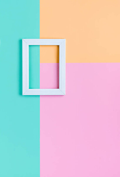 Abstract pastel flat lay background with soft colors and white wooden frame. Geometric composition, copy space. 